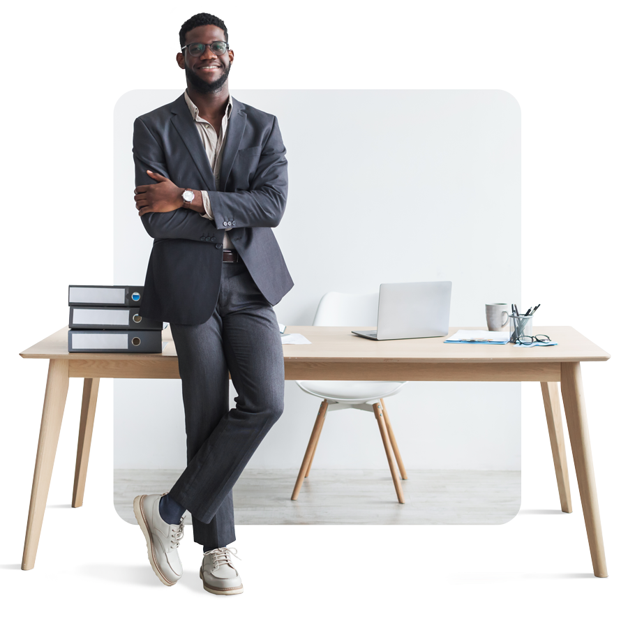 full-length-happy-young-black-businessman-formal-suit-standing-with-crossed-arms-near-office