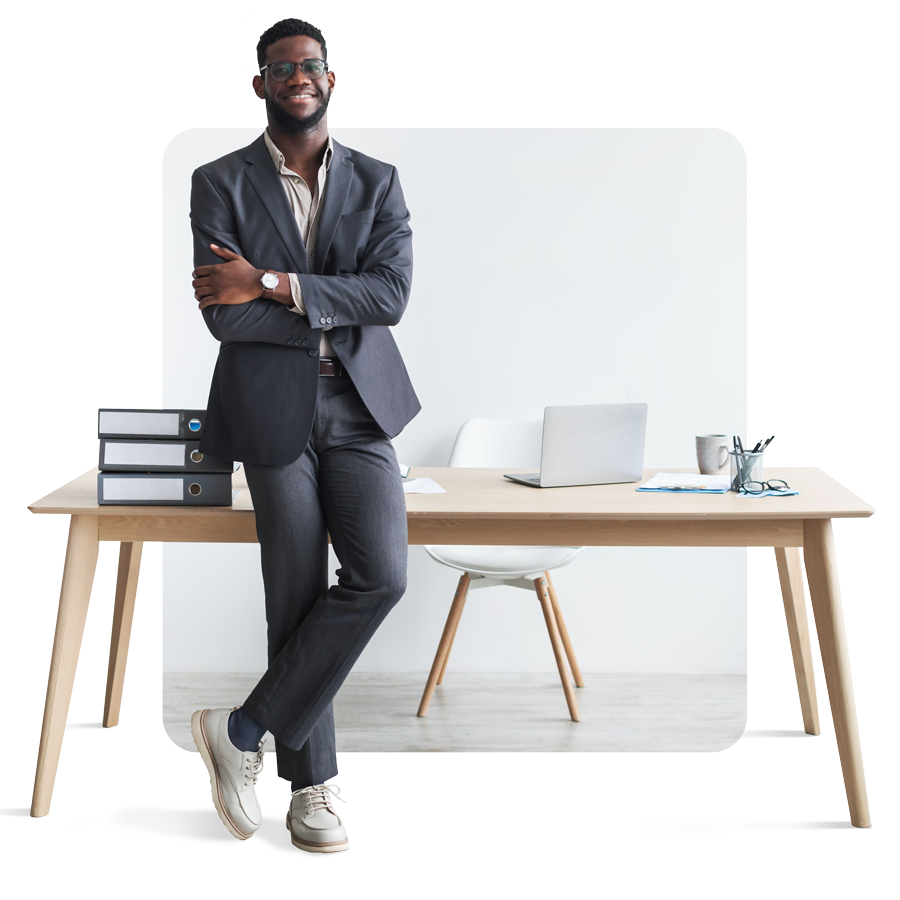 full-length-happy-young-black-businessman-formal-suit-standing-with-crossed-arms-near-office